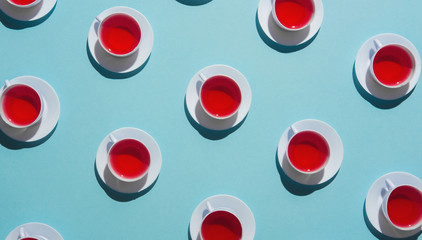 Tea time/cups of tea arranged.