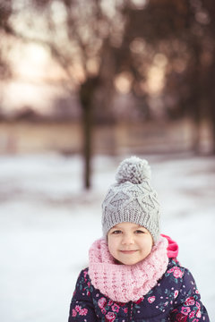 Winter portrait of a cute smiling girl
