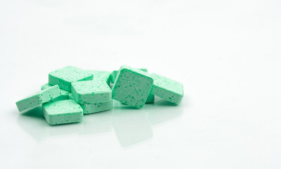 Medical lozenges for relief cough, sore throat and throat irritation on white background with copy space. Apple flavored.
