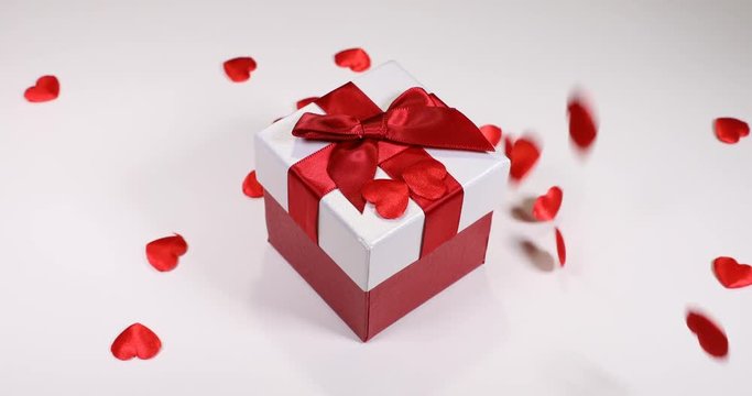 Red hearts falling down on Gift for Valentines Day