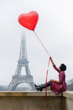 girl on the background of the Eiffel Tower