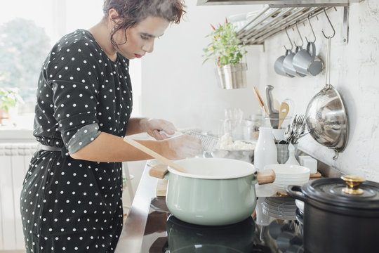 Woman Cooking in The Kitchen