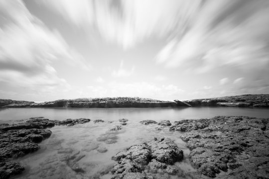 Long exposure and black and white image of stones on the beach