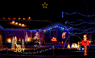 A home on the tour of lights that is done in the classic Christmas motif. © Mark Peugh