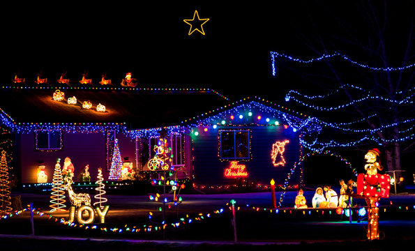 A home on the tour of lights that is done in the classic Christmas motif.