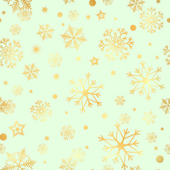 Seamless pattern of gold snowflakes on a green background