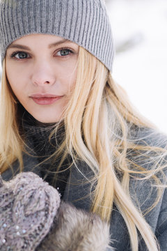 portrait of a beautiful girl in winter closeup