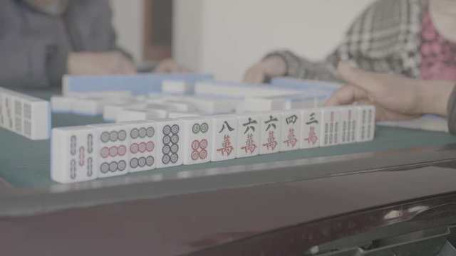 Chinese playing mahjong