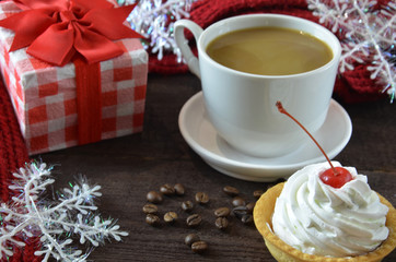 cup of coffee with grains, red burgundy scarf, wooden, winter concept, hot drink, snowflake cap cake, gift box, valentine's day, heart shape symbol on wooden background