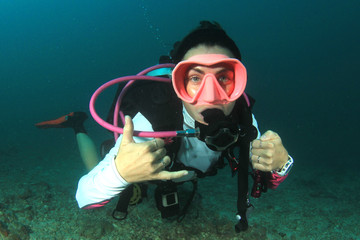 Young woman scuba diving