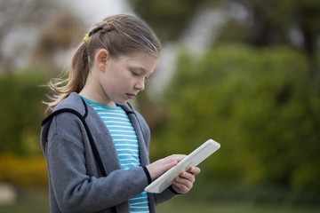 Young girl using digital tablet