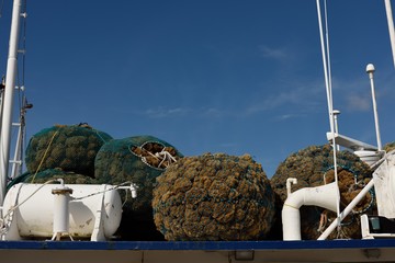 Bags of sea sponges, boat, vessel, blue sky, Tarpon Springs