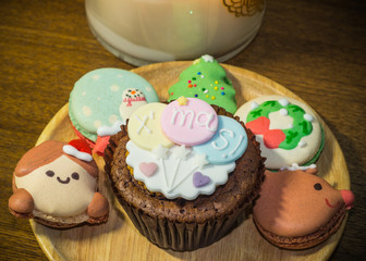 Cupcake and Macarons with lovely Christmas decorations during Christmas festival.