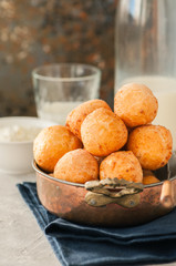 Small cottage cheese doughnuts (castgnole) in a vintage bowl. Festive dessert.