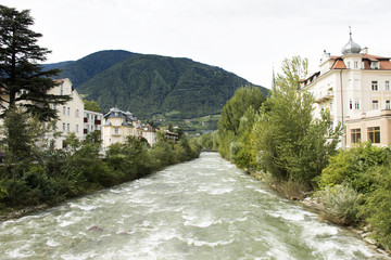 Fototapeta na wymiar View cityscape and landscape with Classical building at riverside of of Passer river at Meran or Merano city in Italy