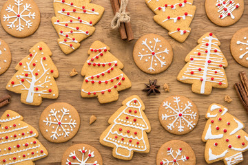 Christmas gingerbread cookies on wood background