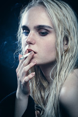 blond woman smoking