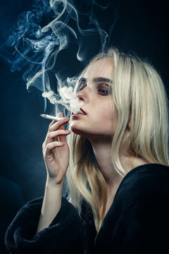 blond woman smoking