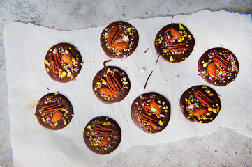 homemade chocolate with nuts on gray background 