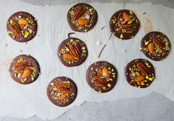 Delicious chocolate candies on a grey background