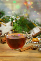 mulled wine with gingerbread cookies on wooden table