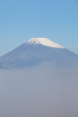 Top of Mt.Fuji with fog in autumn season morning