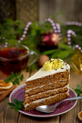 piece of cake on the Christmas table with a Cup of tea