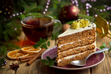 piece of cake on the Christmas table with a Cup of tea