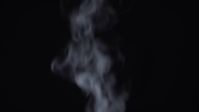 Steam rises on a black background