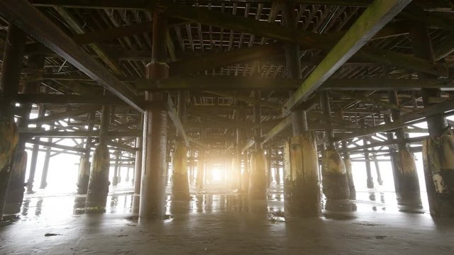 High quality video of walking under pier in 4K 