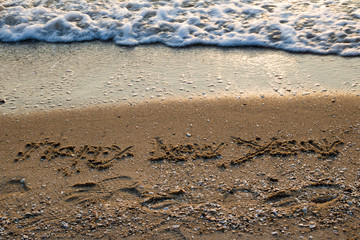 Soft Blue Ocean Wave On Sandy Beach In the morning