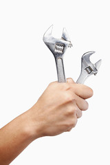 Hand holding a spanner wrench