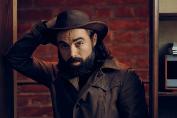 Funny Man Wearing Cowboy hat in Western Style Portrait 