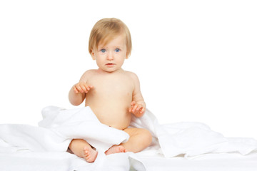 Caucasian baby covered with towel isolated on white background