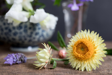 Flower arrangement with paper daisies