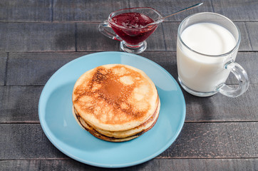 Small pancakes on a blue plate