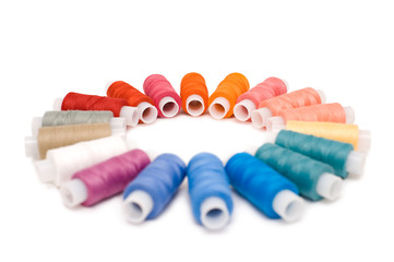 coloured reels of thread