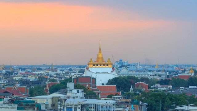 Time lapse of Golden pagoda of Wat Saket Temple / Golden Mount Temple public landmark in Thailand
