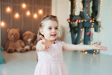 portrait of cute smiling 5 years old child girl celebrating birthday