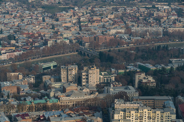 TBILISI, GEORGIA - DEC. 15, 2017 : The city of Tbilisi in the afternoon taken from the Funicular Park on the hill