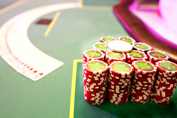 playing cards money chips on a green table