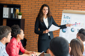 Businesswoman leader conducting company sales presentation in the meeting