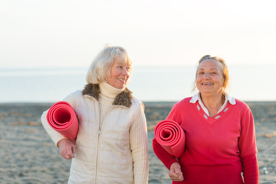two senior women workout outdoor