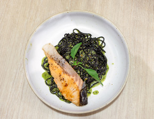Black Spaghetti herb sauce with grilled salmon