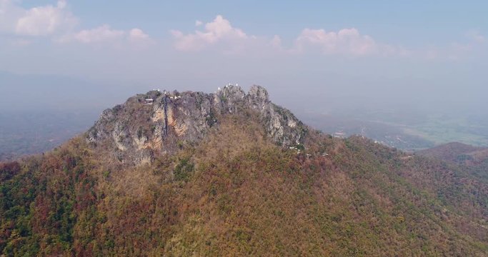 LAMPANG, THAILAND, MARCH 2017: Aerial view over Wat Chalermprakiat, a mountain top Temple in Lampang district, north Thailand.