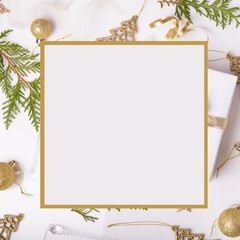 Christmas holiday composition. Festive creative golden pattern, xmas gold decor holiday ball with ribbon, snowflakes, christmas tree on white background.