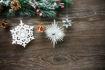 Christmas and New Year's composition. The pine cones, spruce branches on a wooden background