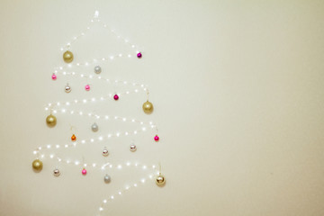 Obraz premium tree made of garland decorated with Christmas balls