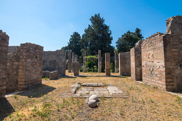 Walking around the ruins and the empty streets of the ancient antique site of Pompeii destroyed by...