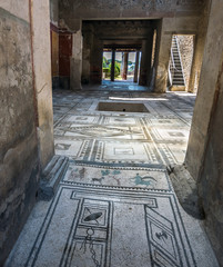 Walking around the ruins and the empty streets of the ancient antique site of Pompeii destroyed by...